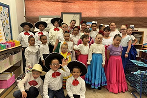 Group photo of students in Folklórico costumes